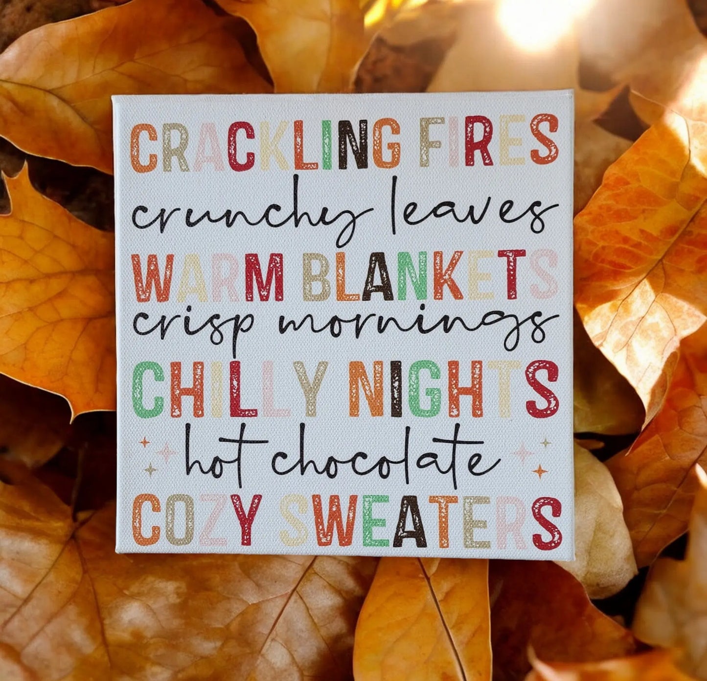 The Mirabilia Boutique Fall Words Canvas Sign, an 8x8 cradled wood canvas with UV-printed autumn phrases, adds cozy seasonal charm to your home—perfect fall decor for fans of crisp leaves and warm vibes.