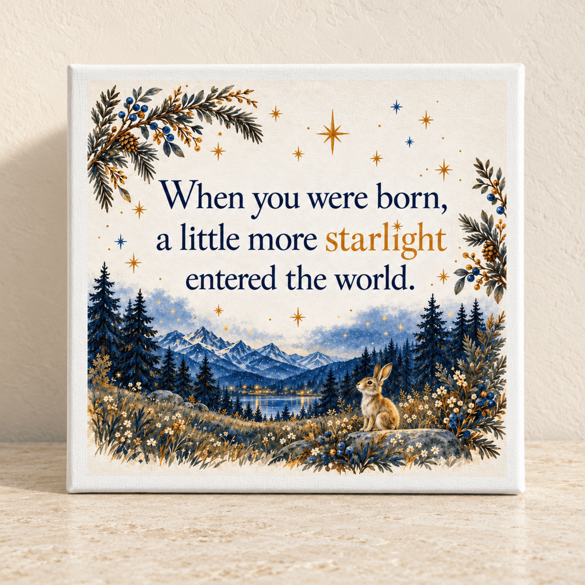 A Little More Starlight Canvas features a rabbit sitting in a forest landscape below mountain peaks at twilight with the text “When you were born, a little more starlight entered the world.”
