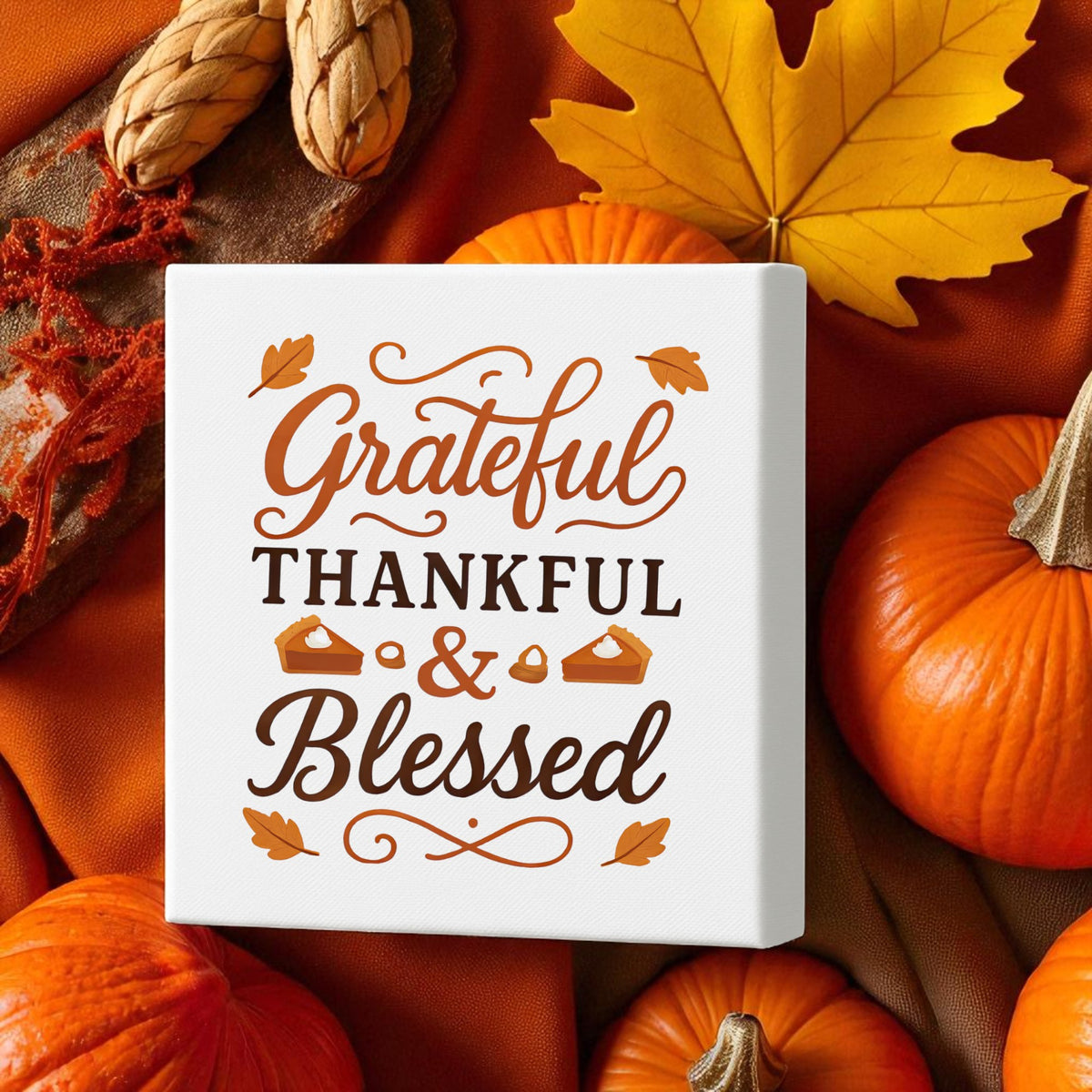 The Grateful Thankful Blessed Canvas (8x8) from Mirabilia Boutique features autumn pumpkins, leaves, and acorns—perfect fall wall art for warming up your space and celebrating Thanksgiving.