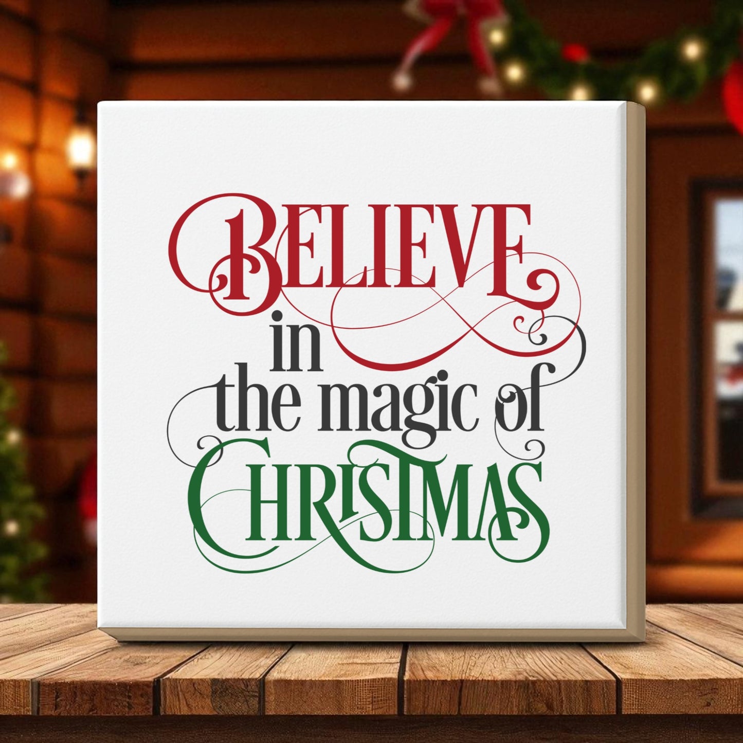 The Mirabilia Boutique "Believe in the Magic of Christmas Wall Art" features festive red and green script, perfect for holiday décor. Display it on your table surrounded by holiday lights and greenery for a magical touch.