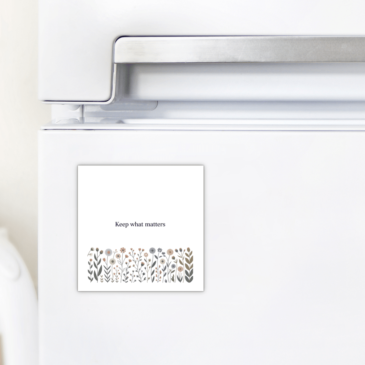 The Keep What Matters Floral Magnet by Mirabilia Boutique adds a charming cottage touch to any white fridge and makes a heartfelt gift with its inspiring message: "Keep what matters.