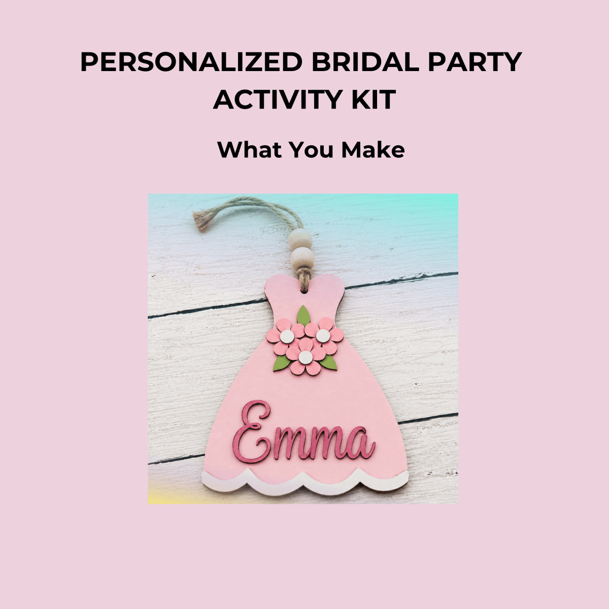 A pink wooden dress ornament with floral details and the name “Emma,” on a light wood background. Text above: “Mirabilia Boutique Personalized Bridal Party Activity Kit—create a fun bridal shower keepsake or custom luggage tag.”.