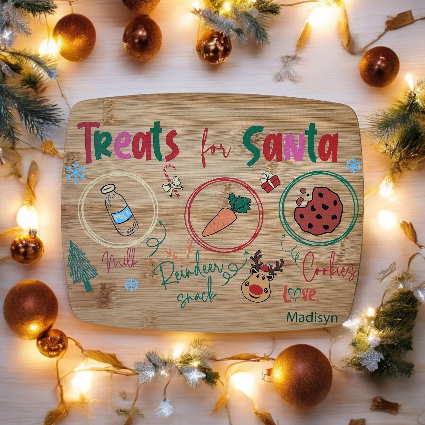 The Mirabilia Boutique Personalized Santa Treat Tray is a custom bamboo Christmas Eve board labeled "Treats for Santa," with sections for milk, cookies, and reindeer snacks. Add any name—perfect for festive traditions!.