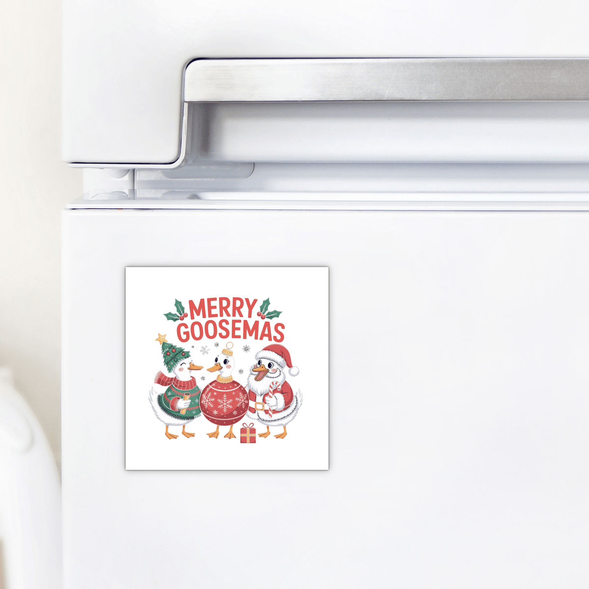 Decorate your fridge with the Merry Goosemas Magnet by Mirabilia Boutique—featuring three festive geese, ornaments, presents, and cheerful "Merry Goosemas" text. A funny Christmas goose gift perfect for the holiday season!.