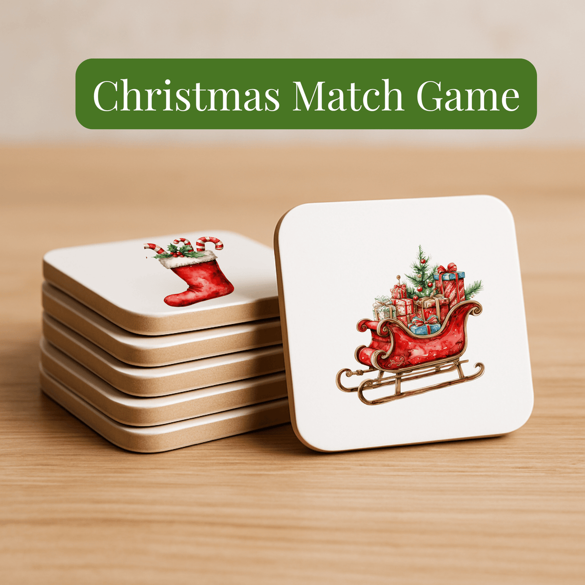 Christmas Memory Match Game | Holiday Tile Game by Mirabilia Boutique: Stack of square cards with festive art—stocking, sleigh of gifts and tree—on a wooden surface. Perfect for holiday fun!.