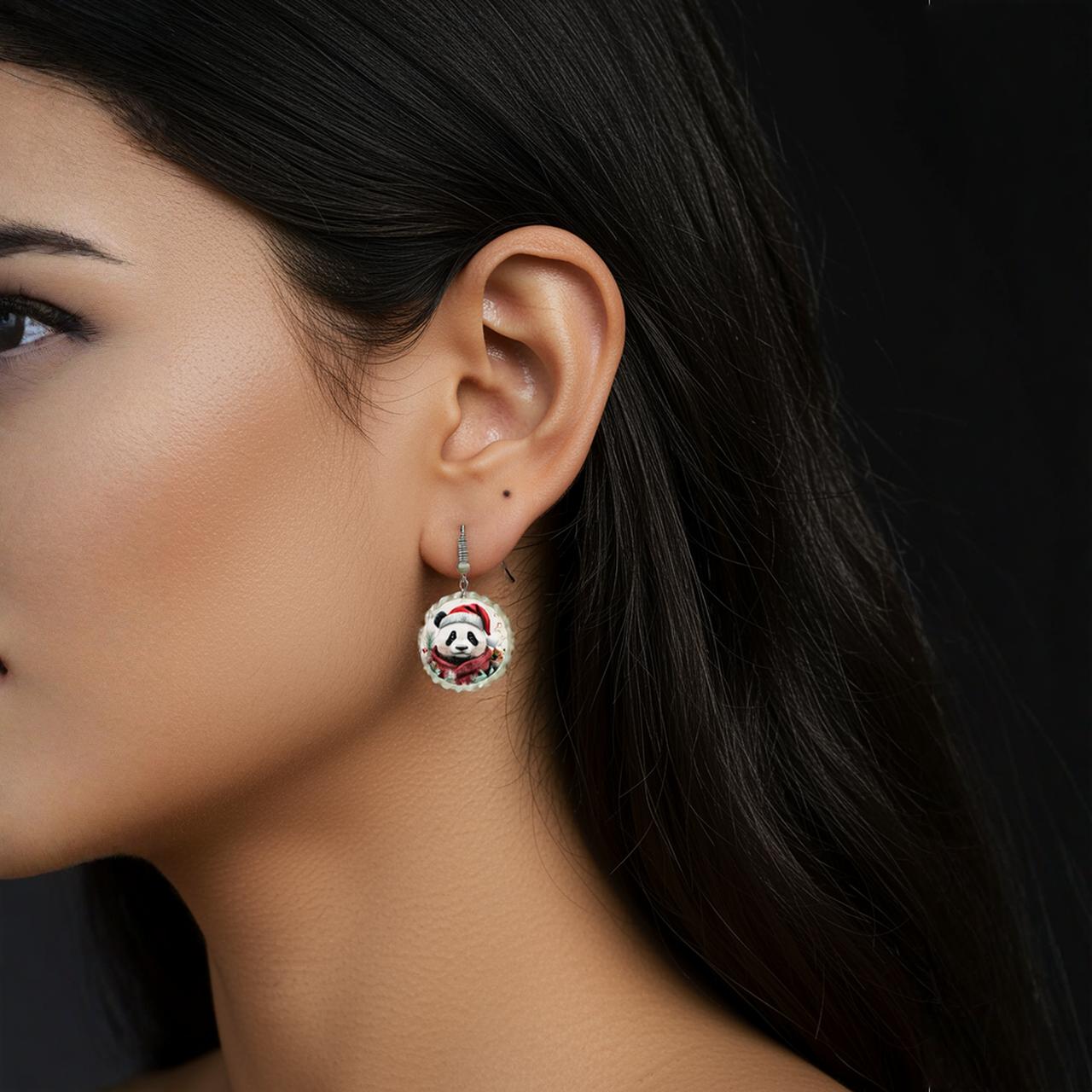 A woman with straight dark hair wears Mirabilia Boutique’s Christmas Panda Earrings | Cute Holiday Dangle Jewelry—hypoallergenic festive earrings with a red and white border, brightening her look against a plain black background.