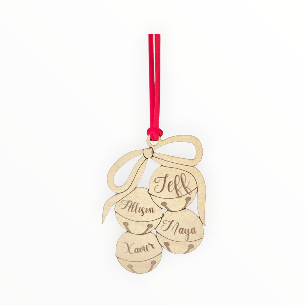 The Mirabilia Boutique Custom Family Christmas Ornament features laser-cut wood shaped as three jingle bells and a bow, personalized with the names Jeff, Allysen, Xavier, and Maya. This festive ornament hangs from a red ribbon.