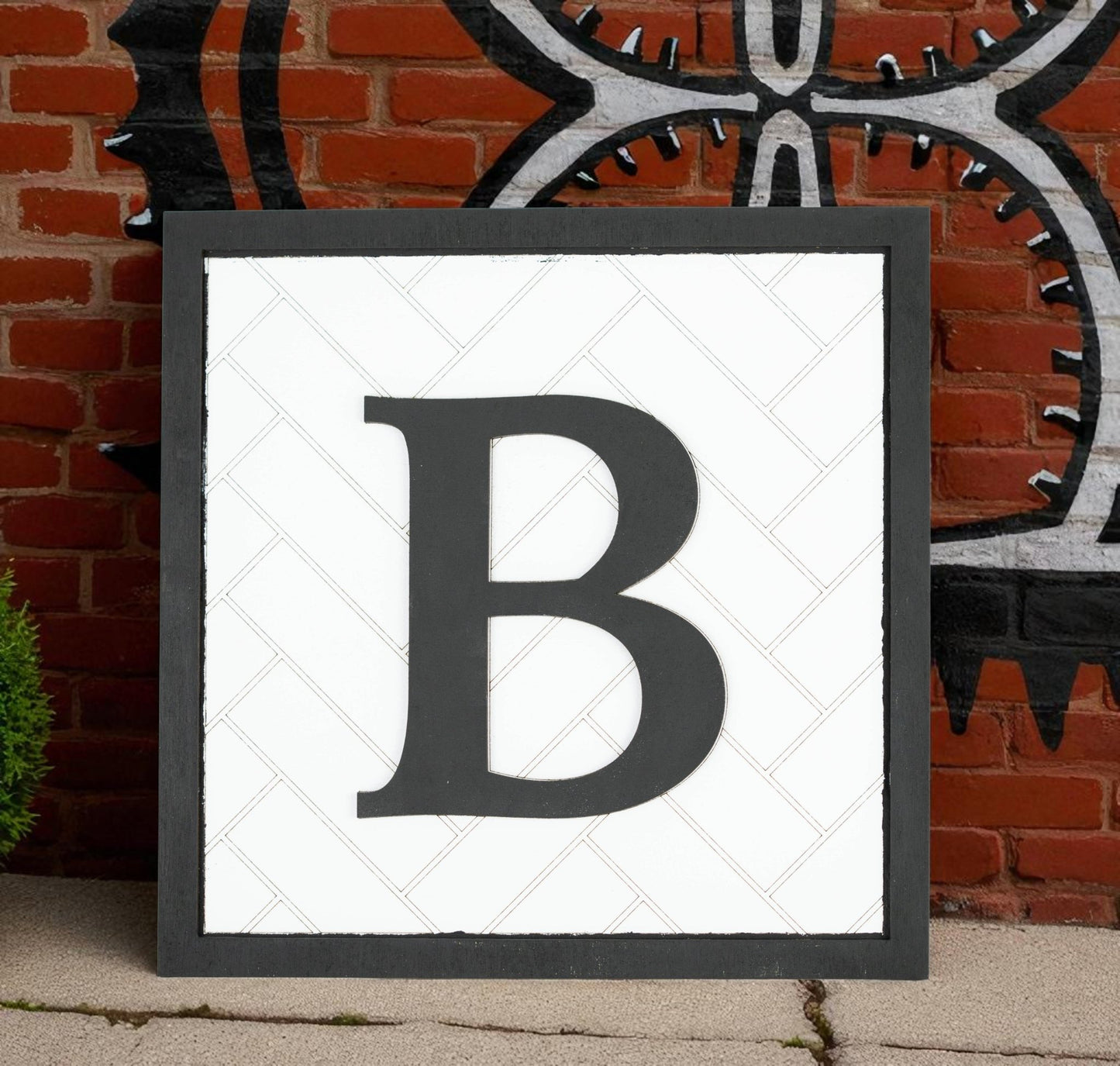 The Mirabilia Boutique Custom Initial Shelf Sign features a bold letter on a 10x10 herringbone backer—ideal personalized decor for your modern farmhouse style.