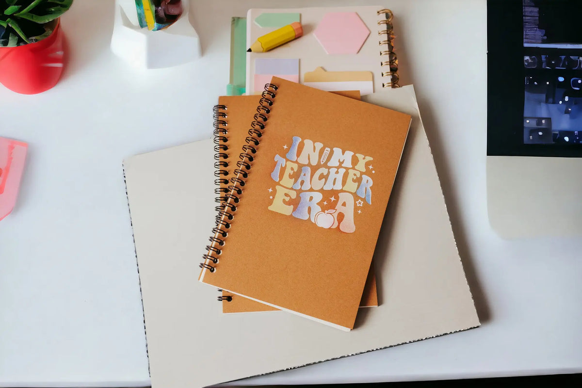 The In My Teacher Era Notebook by Mirabilia Boutique is an aesthetic spiral journal—an ideal back-to-school teacher gift for classroom inspiration.