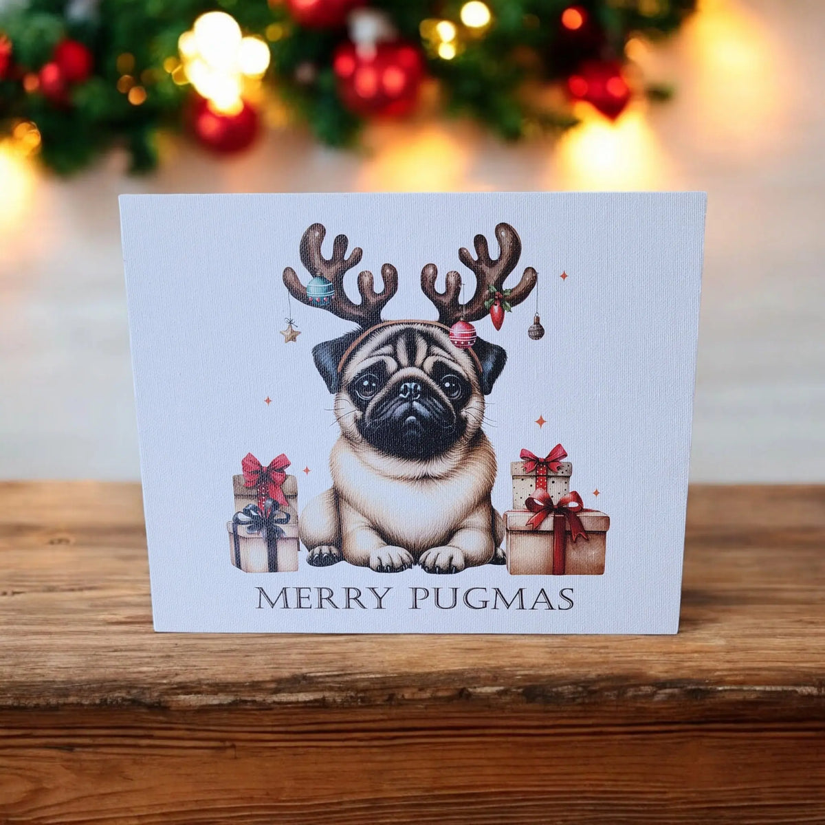 Mirabilia Boutique's "Merry Pugmas" Canvas Wall Art features a pug in reindeer antlers with presents, festive lights, and décor. UV printed 8x10—funny Christmas décor and a perfect holiday gift for dog lovers.