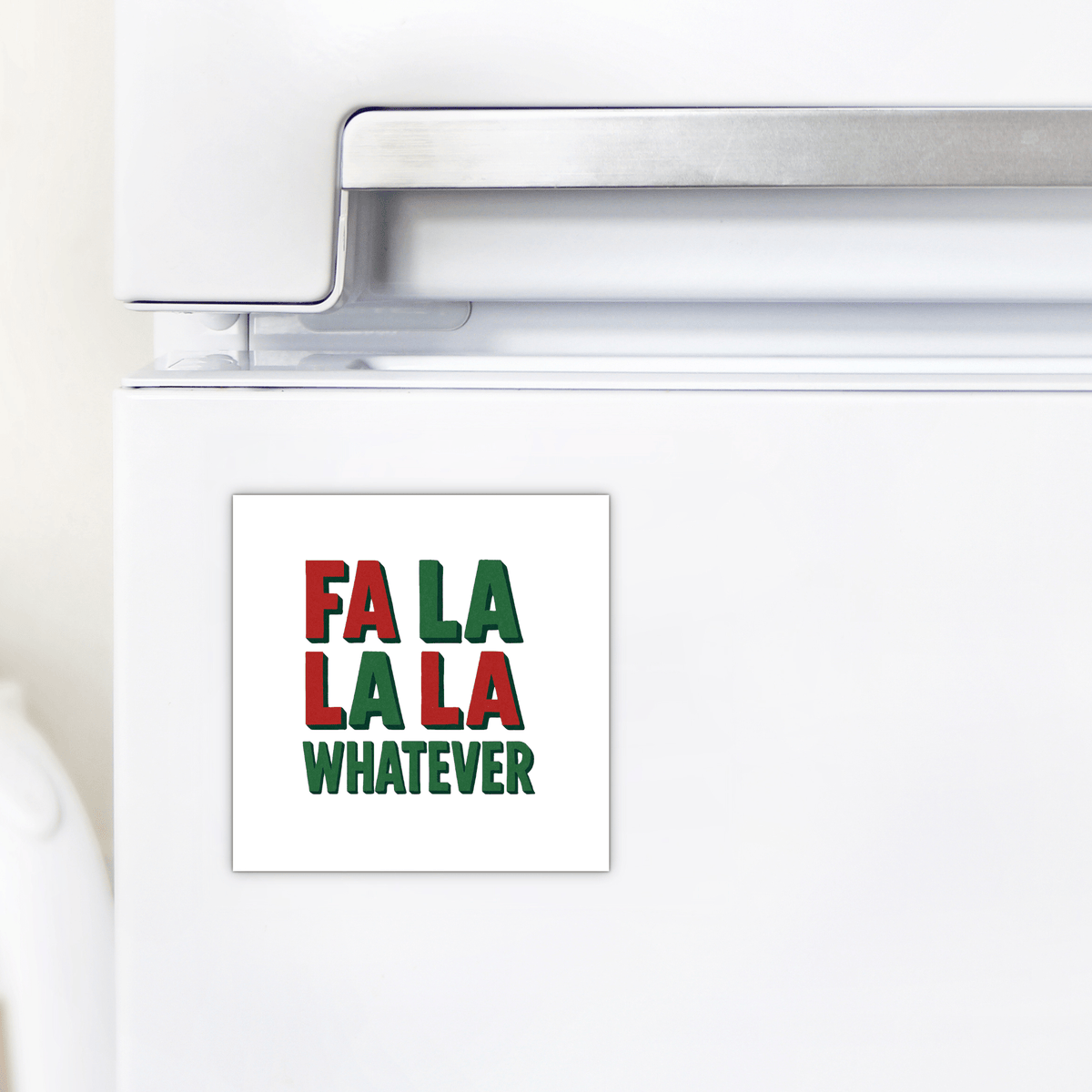 A white refrigerator door features the Fa La La La Whatever Magnet by Mirabilia Boutique, a funny Christmas gift idea with red and green text—a perfect touch of holiday sarcasm.