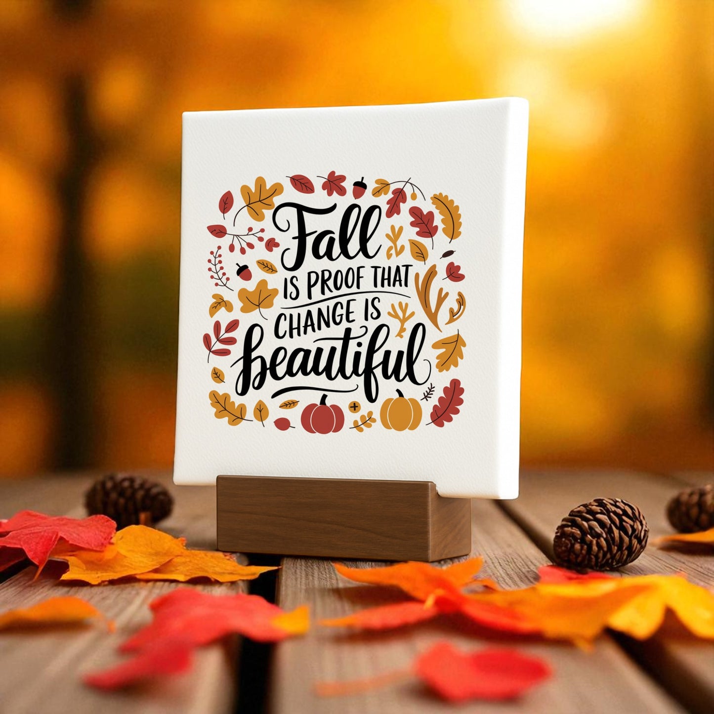 The "Fall Is Proof Mini Sign" by Mirabilia Boutique features the quote "Fall is proof that change is beautiful" on a wooden stand—an inspiring autumn home accent for cozy seasonal decor.