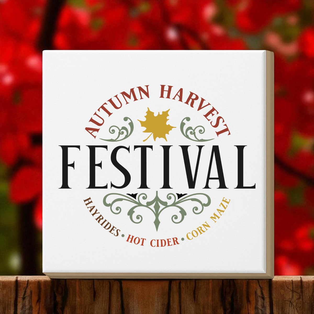 The Mirabilia Boutique Autumn Harvest Festival Canvas Sign (8x8) is perfect rustic fall decor, featuring festive leaves and harvest text on a cozy red and green background with a wooden-look base.
