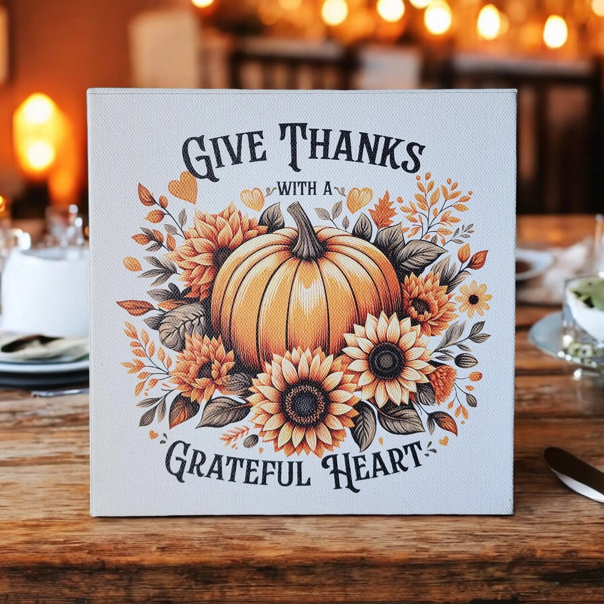 The Mirabilia Boutique "Give Thanks With a Grateful Heart" 8x8 wood sign features a Thanksgiving pumpkin and sunflower design—perfect fall wall art décor for creating cozy autumn vibes.