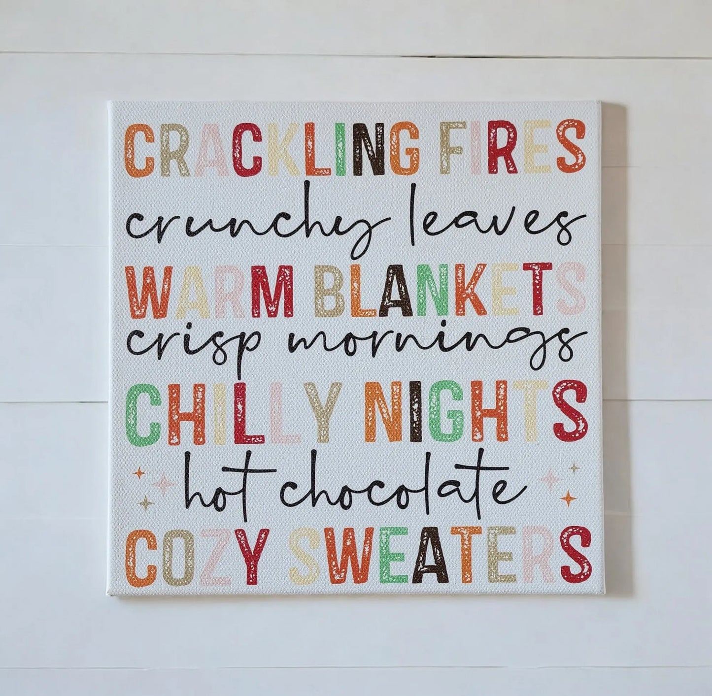 Bring autumn into your home with the Fall Words Canvas Sign from Mirabilia Boutique—an 8x8 UV-printed wood canvas featuring cozy seasonal phrases in fall colors, perfect for warm, inviting decor.