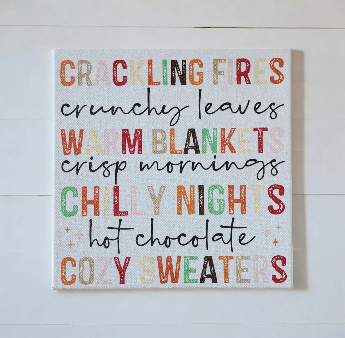Bring autumn into your home with the Fall Words Canvas Sign from Mirabilia Boutique—an 8x8 UV-printed wood canvas featuring cozy seasonal phrases in fall colors, perfect for warm, inviting decor.