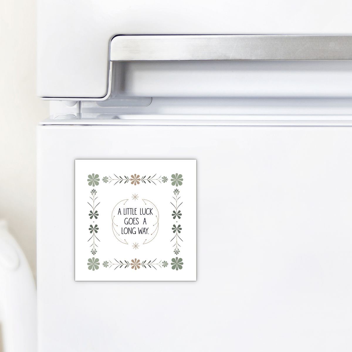 The "A Little Luck Goes a Long Way Magnet" by Mirabilia Boutique displays an inspiring quote in vintage floral style, bringing charm and positivity to any white refrigerator.