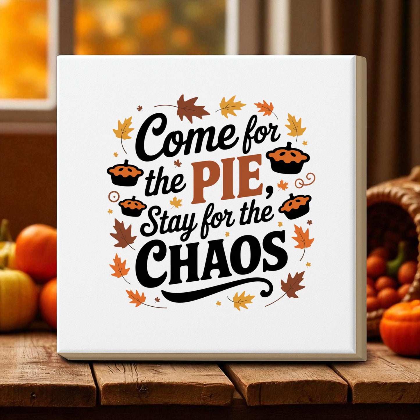 The Mirabilia Boutique "Come for the Pie Chaos Art" canvas adds humor to your Thanksgiving decor, featuring the quote "Come for the pie, stay for the chaos," surrounded by festive autumn pies and leaves.
