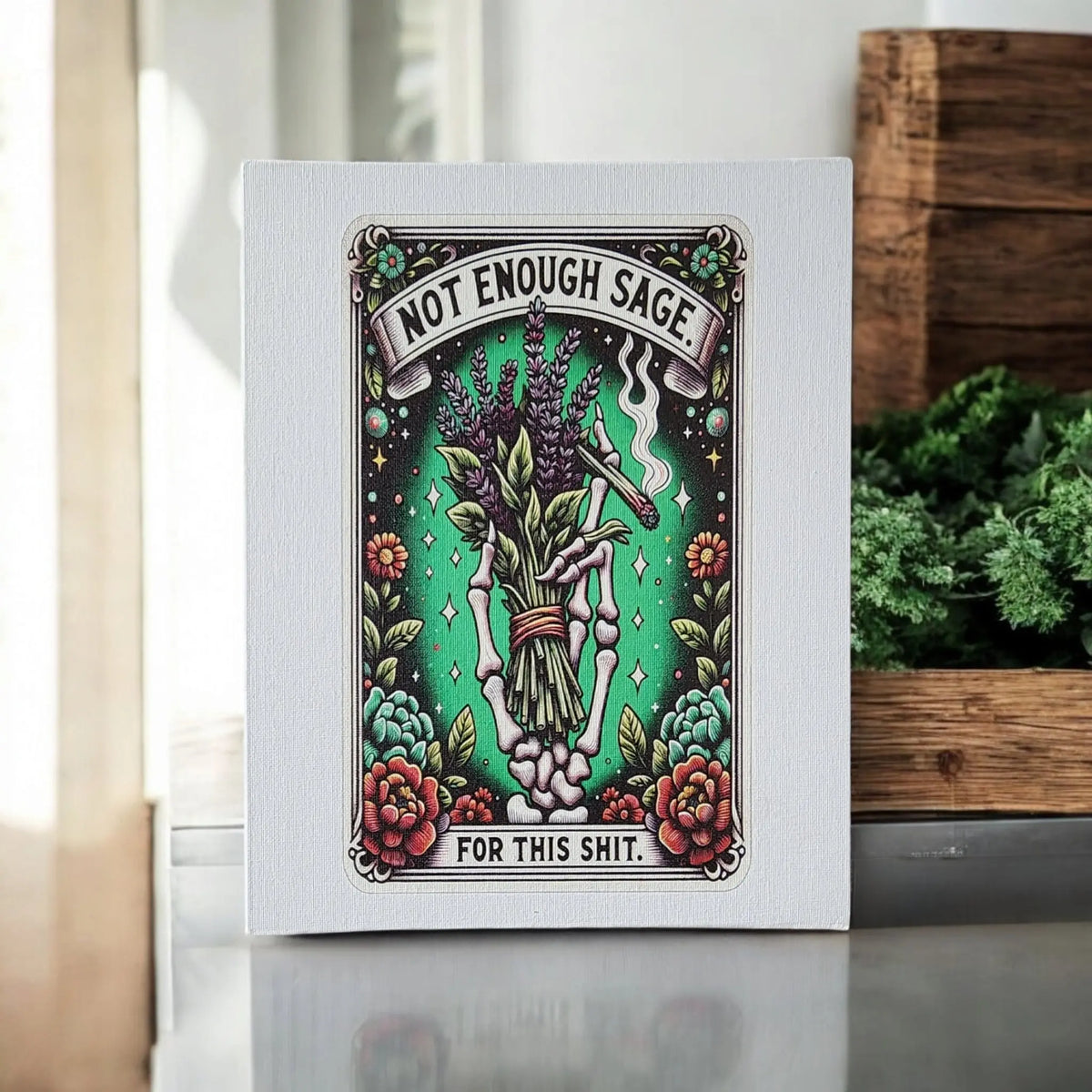 The Not Enough Sage Canvas Print by Mirabilia Boutique features a vintage tattoo-style skeleton hand with sage and lavender, reading "Not enough sage for this shit"—a witchy, sarcastic 8x10 wall art perfect for home decor.