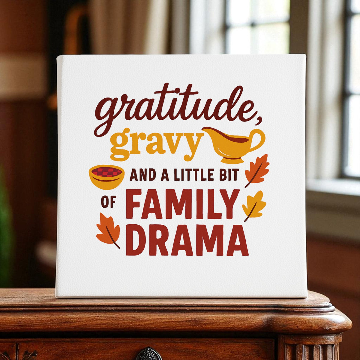 The Mirabilia Boutique Gratitude Gravy & Family Drama 8x8 Canvas features a funny Thanksgiving quote with festive art—perfect decor for your home or a unique gift for family gatherings.