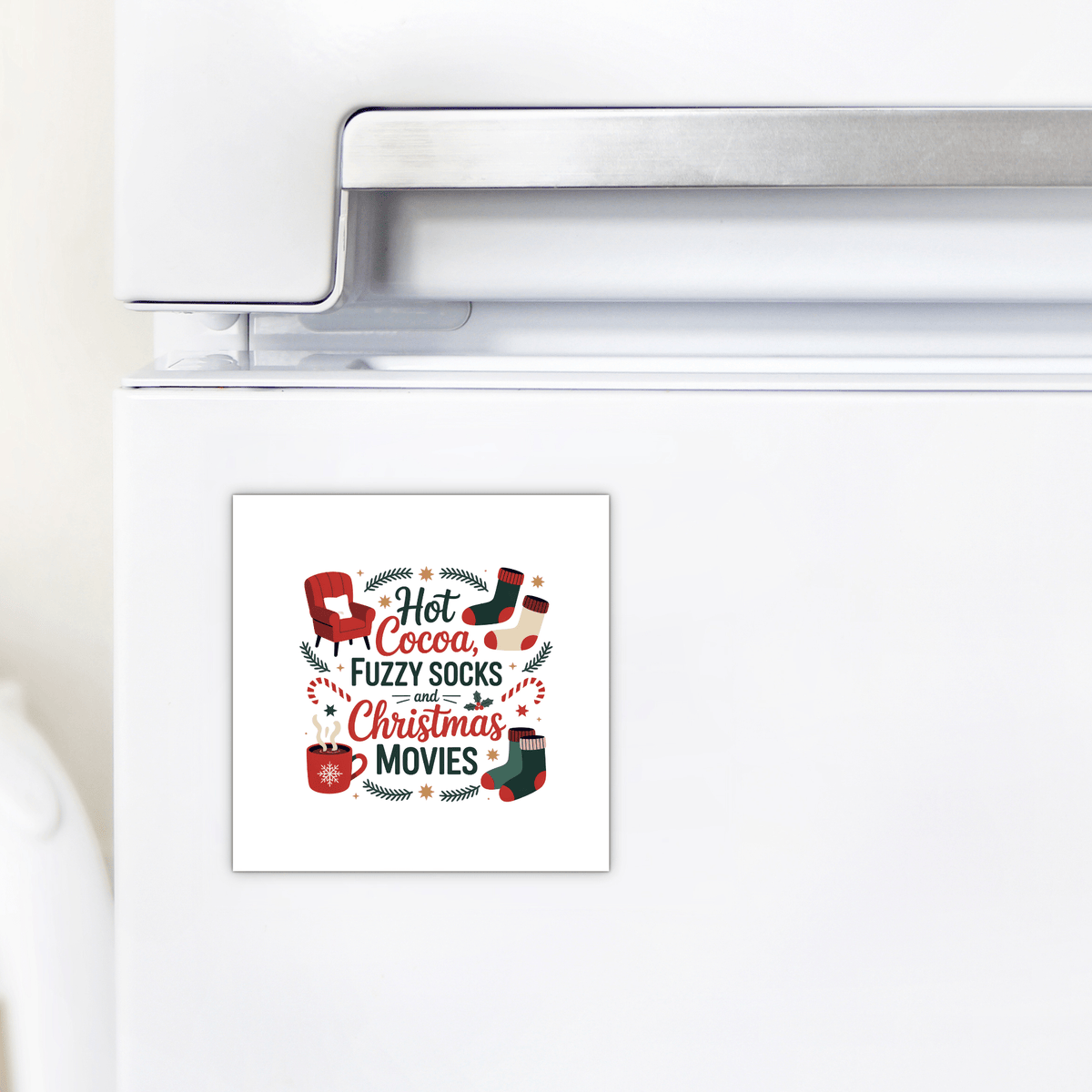 The Mirabilia Boutique "Hot Cocoa, Fuzzy Socks, Christmas Movies" magnet decorates a white fridge with festive fonts, featuring a mug, socks, candy cane, and holly—a charming Christmas accent for your home.