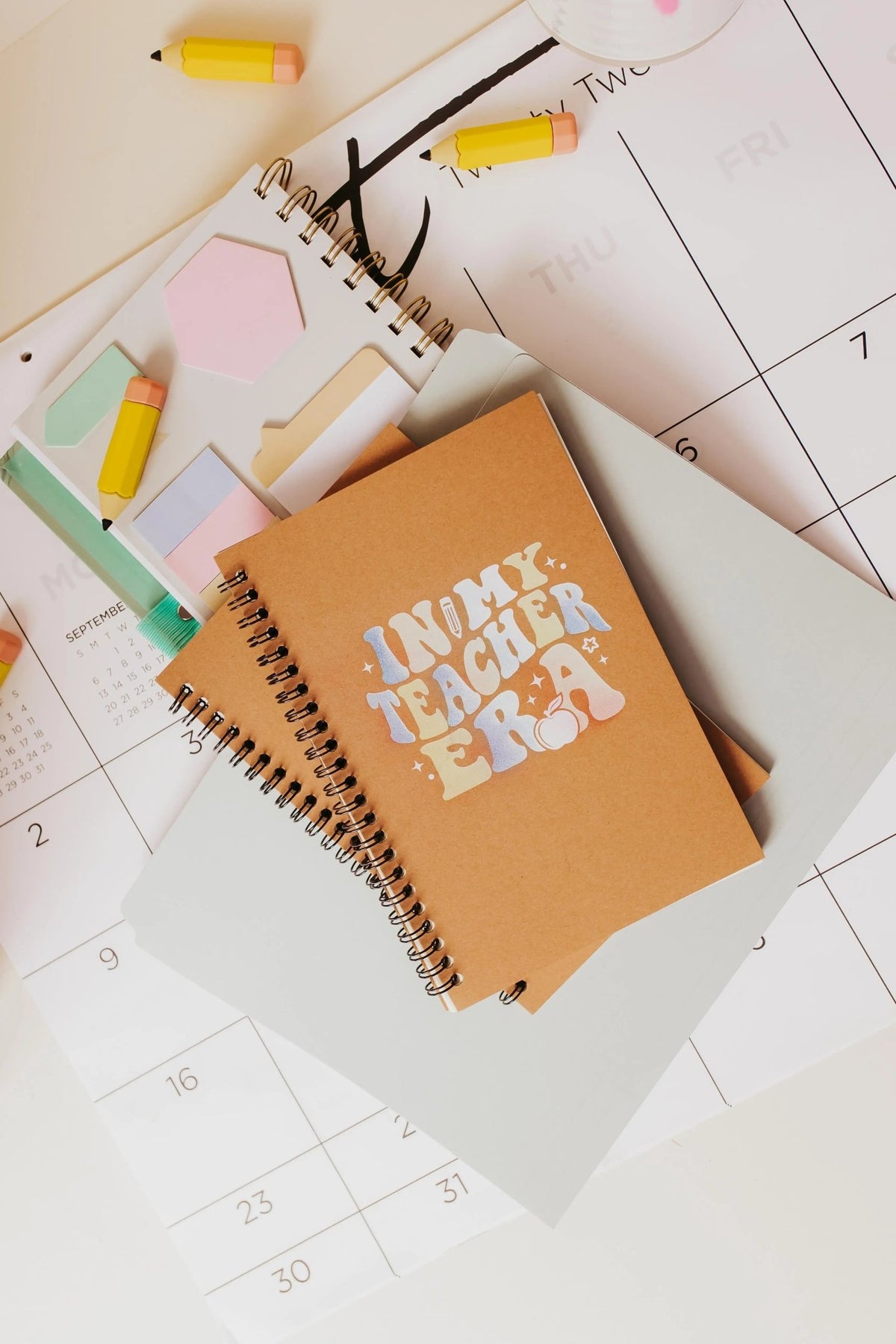 The In My Teacher Era Notebook by Mirabilia Boutique is an aesthetic spiral journal—ideal as a back-to-school teacher gift—and features a retro cover, making it a thoughtful and stylish choice for any educator.