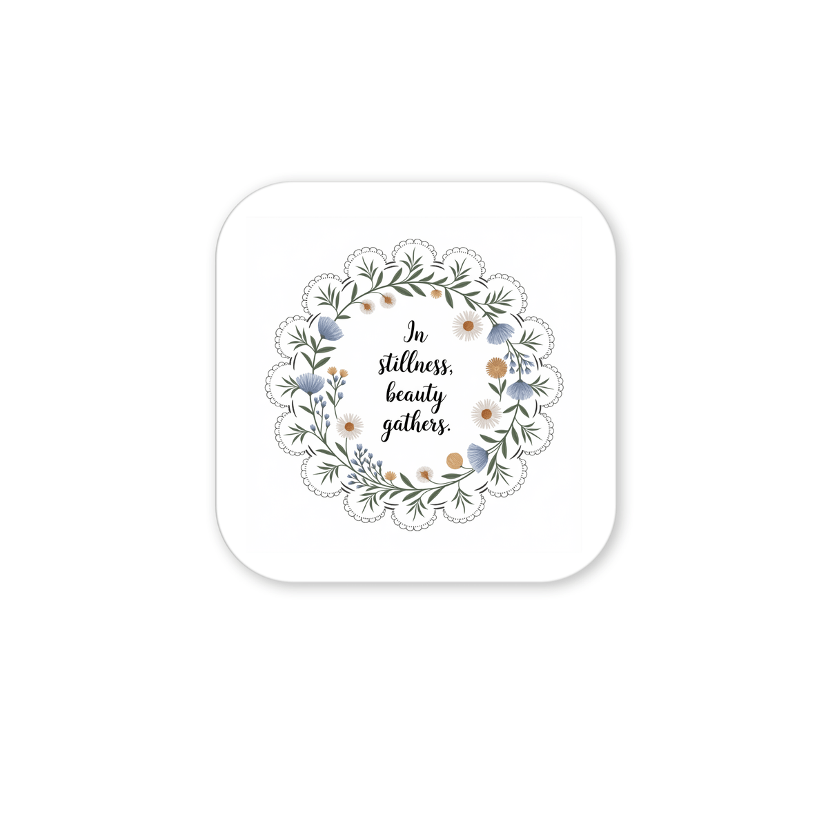The Mirabilia Boutique In Stillness Beauty Gathers Floral Quote Magnet features a square design with a wreath of green leaves and flowers around the handwritten quote—an inspiring mindfulness accent for any space.