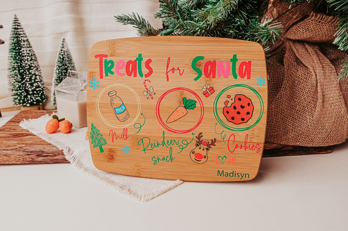 The Mirabilia Boutique Personalized Santa Treat Tray is a custom bamboo Christmas Eve board labeled "Treats for Santa," featuring colorful milk, cookie, and carrot drawings with handwritten notes—an adorable way to serve Santa and his reindeer.