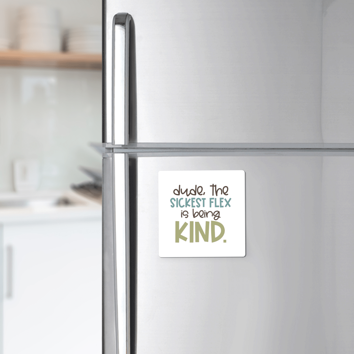 The Sickest Flex Is Being Kind Magnet by Mirabilia Boutique, featuring the phrase "dude. the SICKEST FLEX is being KIND," adds inspiration to any bright kitchen—perfect for teachers or uplifting classroom décor.