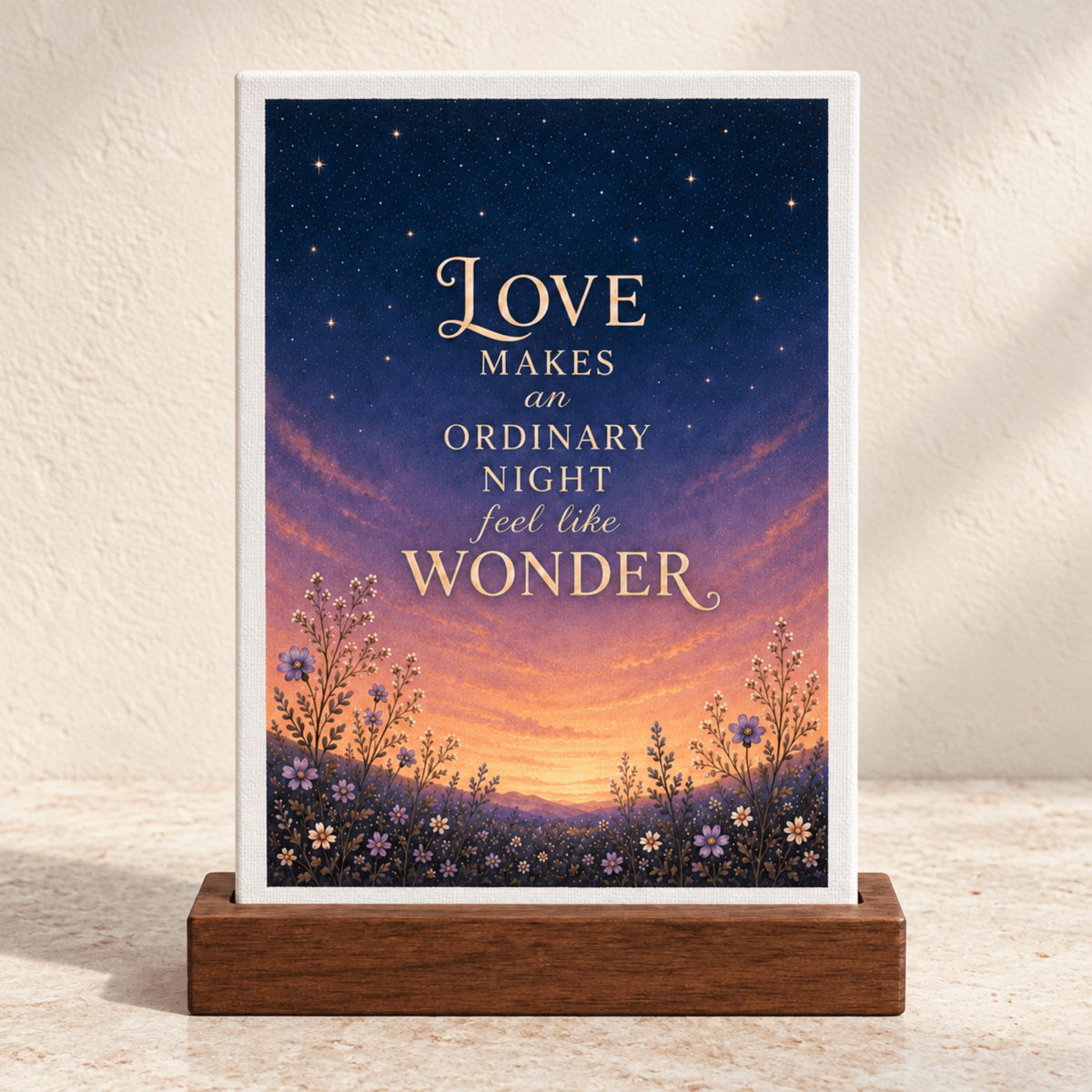 Love Makes Wonder Romantic Mini Sign featuring a sunset and starry night sky with wildflowers and the text, “Love makes an ordinary night feel like wonder.”