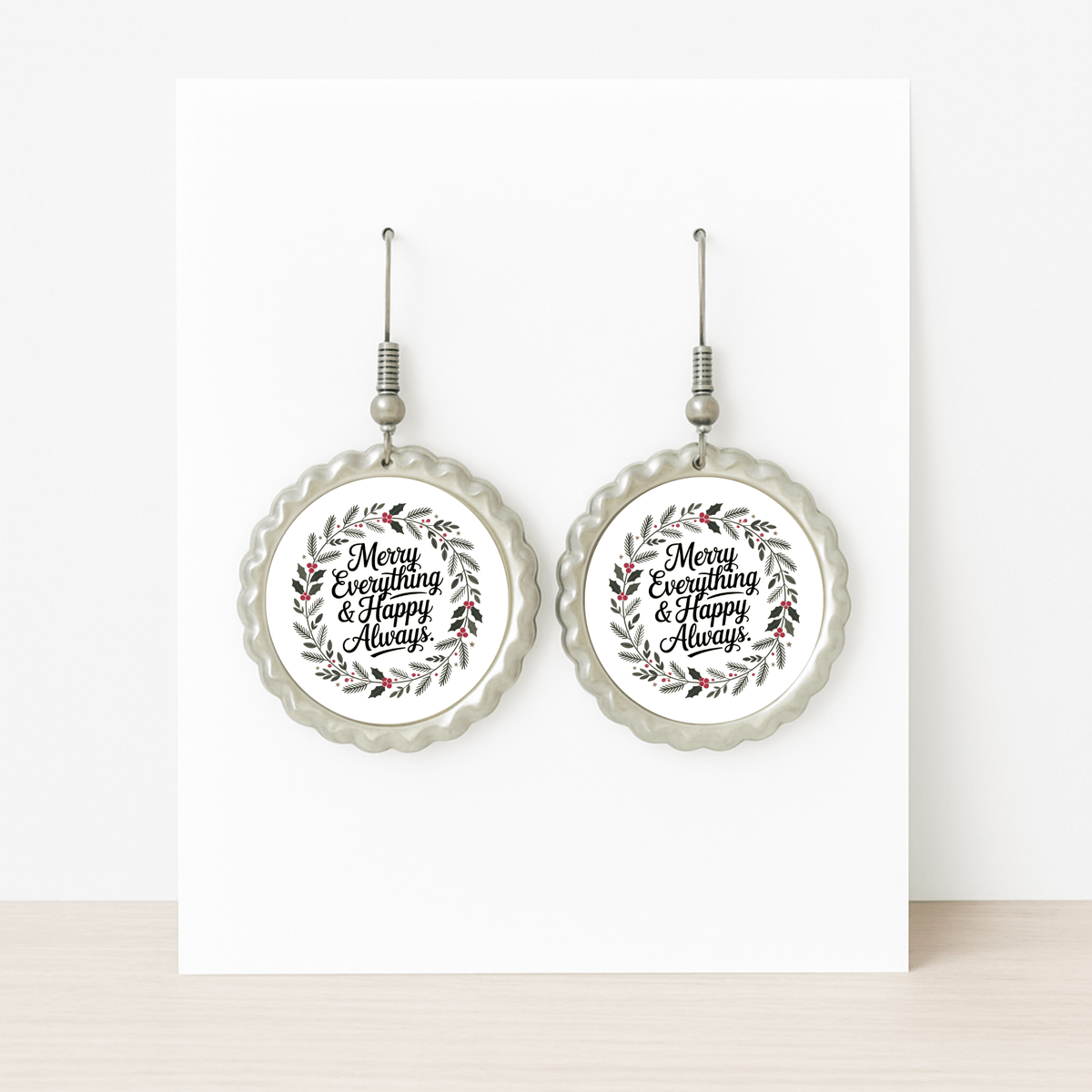 The Merry Everything Earrings by Mirabilia Boutique feature scalloped edges and a festive wreath with "Merry Everything & Happy Always," making them the perfect holiday jewelry or Christmas gift for her, shown on a white background.