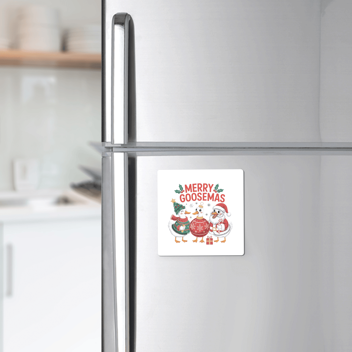 A kitchen fridge displays the Merry Goosemas Magnet by Mirabilia Boutique—a funny Christmas goose gift featuring cartoon geese in festive attire, perfect for adding cheerful holiday decor to your home.
