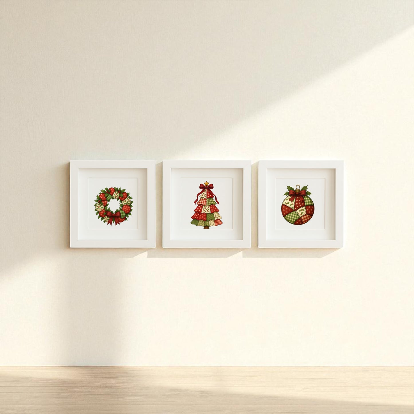 The Patchwork Christmas Wall Art Trio by Mirabilia Boutique features three 5x5 white-framed shadowbox prints—a wreath, tree, and ornament in festive red and green—adding handmade holiday charm to your decor.