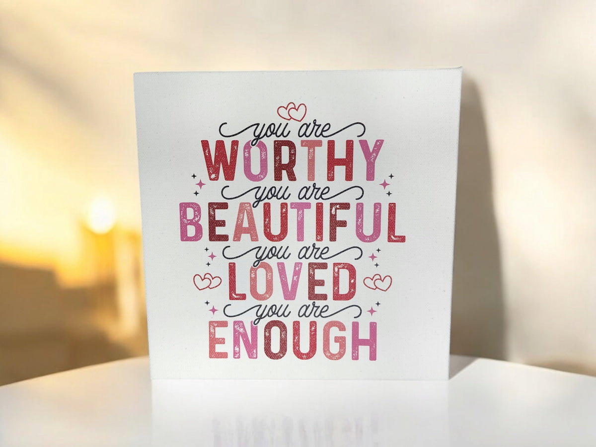 The Mirabilia Boutique "You Are Worthy Affirmation Sign" is an 8x8 canvas wall art for women or teens, featuring pink and red text and heart designs—perfect as inspirational self-love decor or an encouraging gift.
