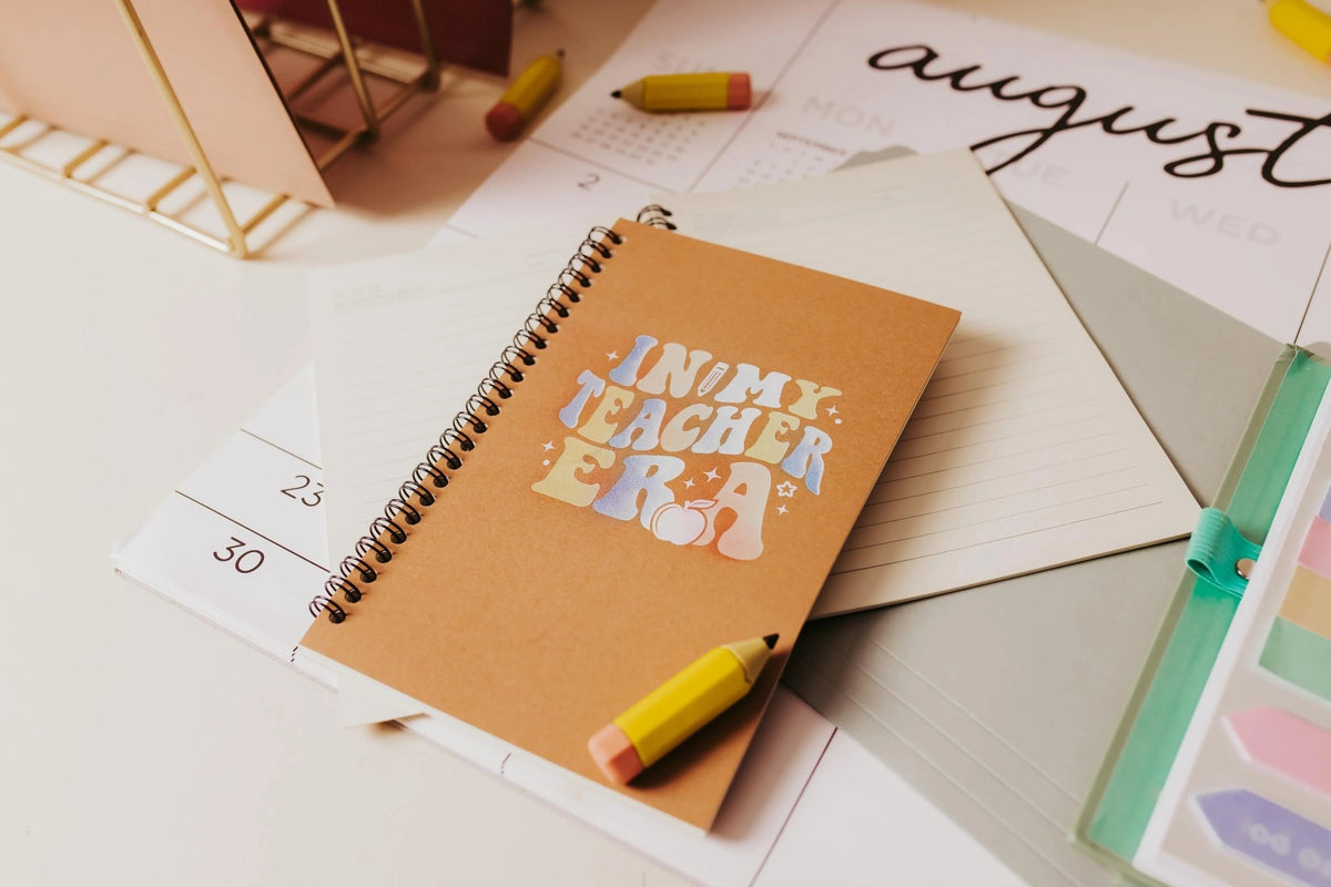 The Mirabilia Boutique "In My Teacher Era Notebook" is an aesthetic teacher spiral journal, perfect as a back-to-school teacher gift for August.