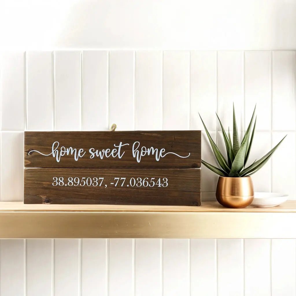 The Personalized Home Sweet Home Coordinates Wood Sign from Mirabilia Boutique, custom-printed with your chosen city’s longitude and latitude, sits beautifully on any shelf—an ideal housewarming gift.