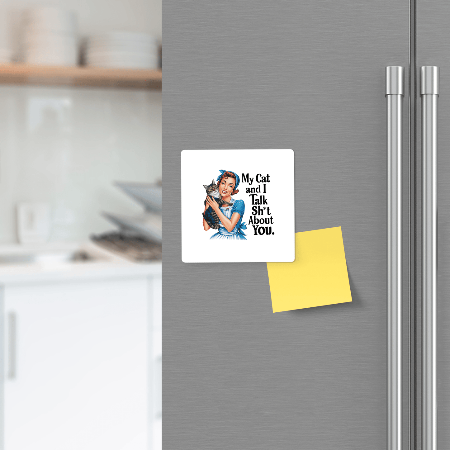 A Mirabilia Boutique "My Cat and I Talk Sh*t" 3x3 UV printed retro fridge magnet shows a woman with her cat and the quote, alongside a blank yellow sticky note on a refrigerator. A kitchen is visible in the background.