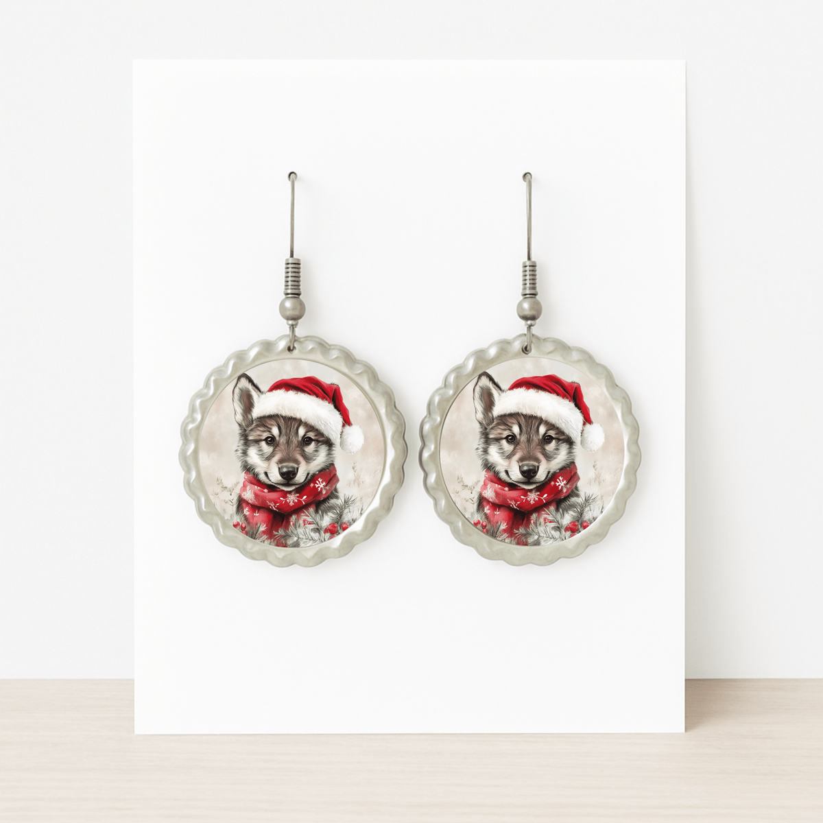 Mirabilia Boutique’s Santa Wolf Earrings are round woodland Christmas jewelry featuring a wolf pup in a Santa hat and scarf—perfect hypoallergenic holiday accessories for festive celebrations.