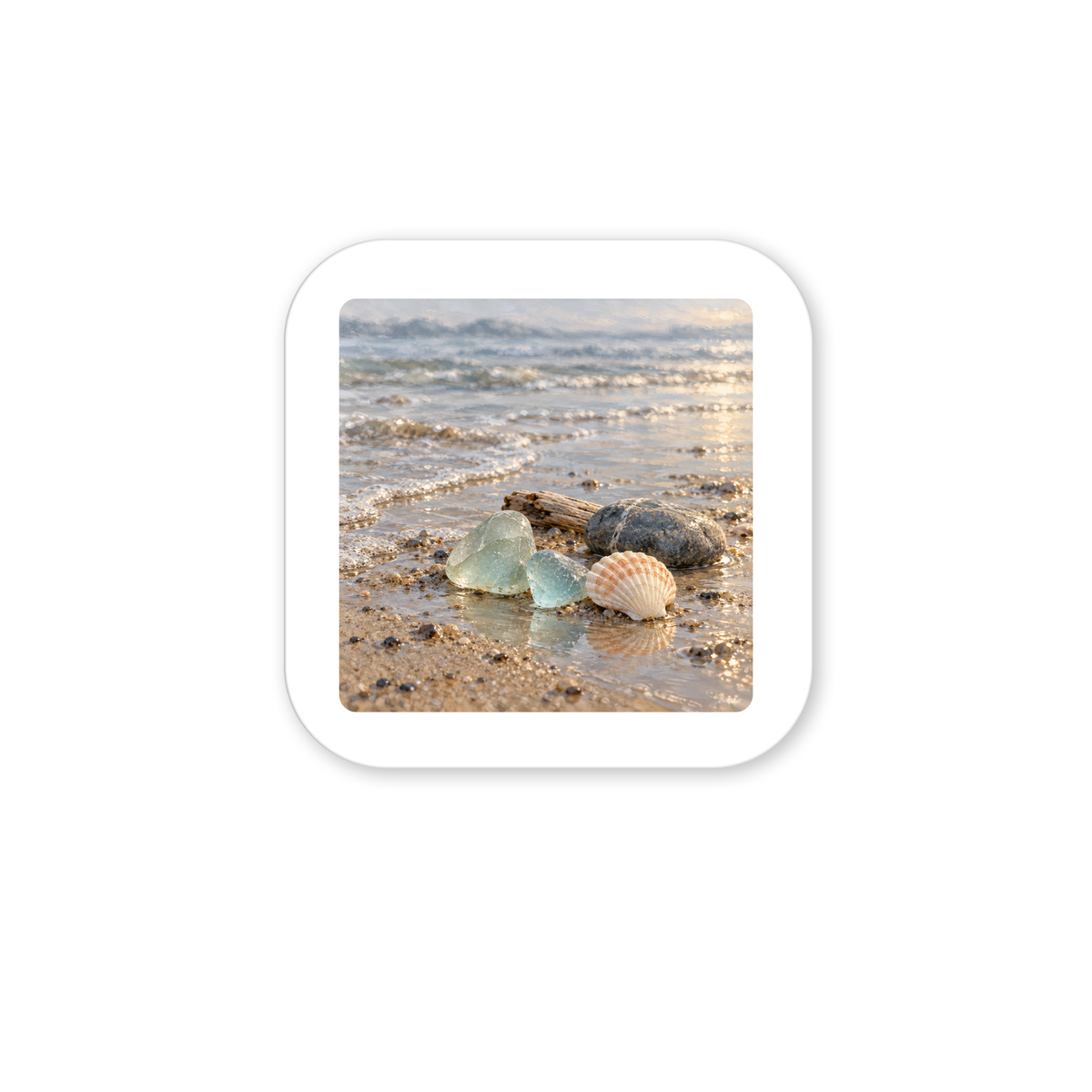 Sea Glass Morning Magnet square magnet featuring a close-up shoreline illustration of sea glass, a seashell, and a small rock on a sandy beach at the water’s edge.