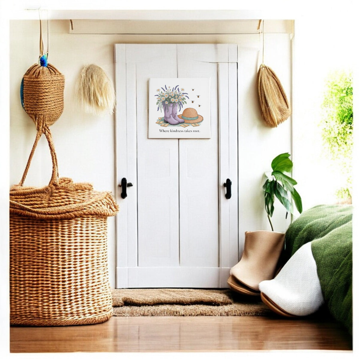 A cozy entryway with a white double door, woven baskets, a potted plant, shoes, and Mirabilia Boutique’s Kindness Takes Root Canvas – Garden-Inspired Wall Art above the door handle completes the fresh spring decor vibe.