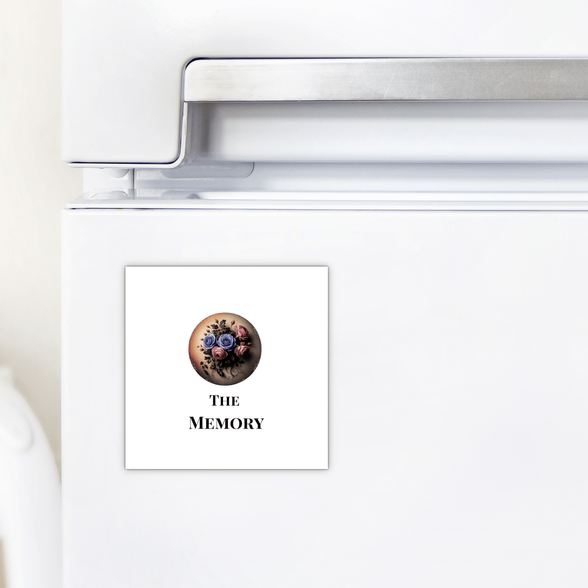 A white fridge door with Mirabilia Boutique’s "The Memory | Dead Regency Magnet"—a square gothic floral magnet featuring "The Memory," perfect for subtle dark decor.