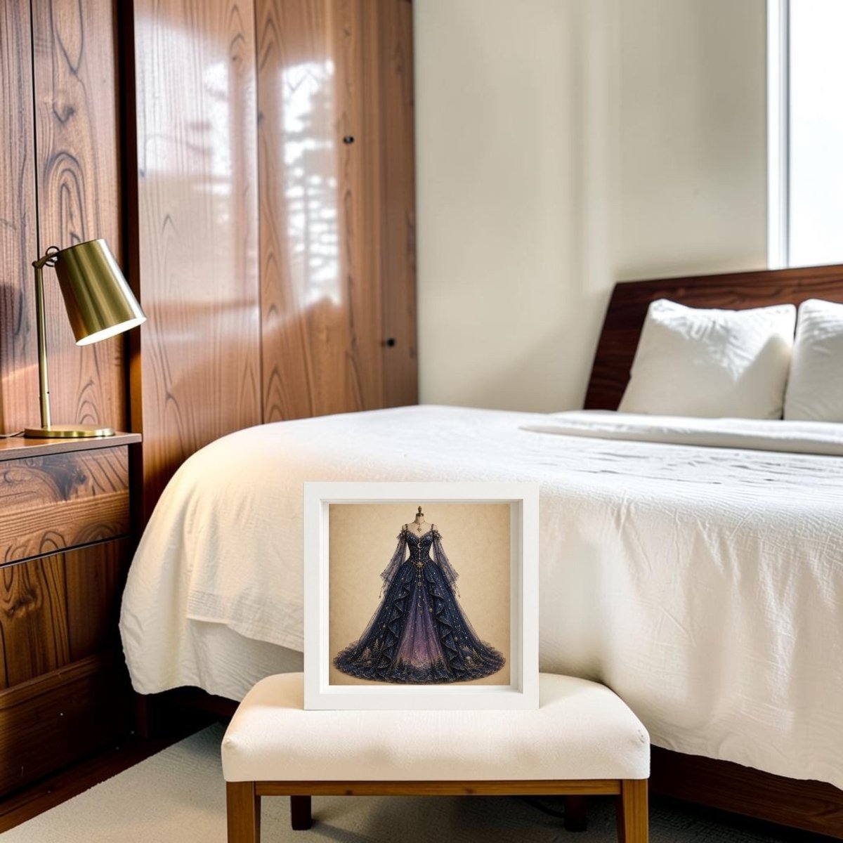 The “Under The Turning Stars | Curated Couture Artwork” by Mirabilia Boutique is elegantly displayed in a frame on a bench at the foot of a neatly made bed, accentuating the modern, wood-accented bedroom featuring crisp white bedding and a gold desk lamp.