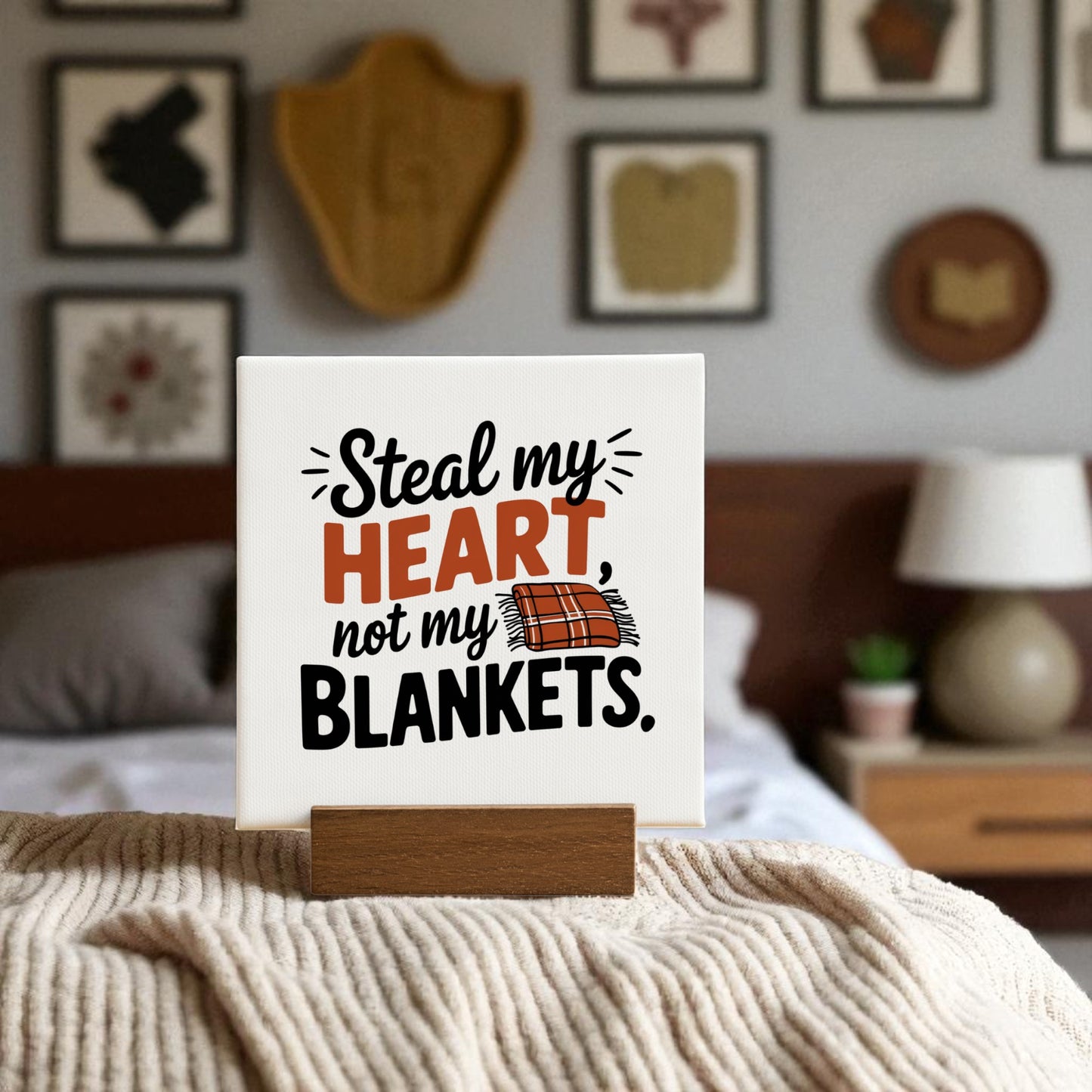 The Steal My Heart Mini Sign by Mirabilia Boutique features a cute blanket cartoon and the phrase "Steal my HEART, not my BLANKETS," making it the perfect funny romantic bedroom decor or couple gift.