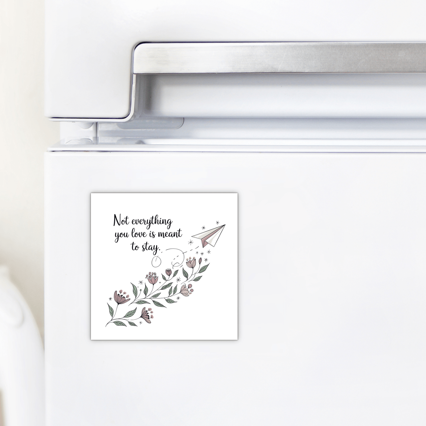 A white fridge with Mirabilia Boutique’s Grief Quote Magnet—featuring floral art, a paper airplane, and “Not Everything You Love Is Meant to Stay”—adds a heartfelt touch to decor or makes a thoughtful sympathy gift.