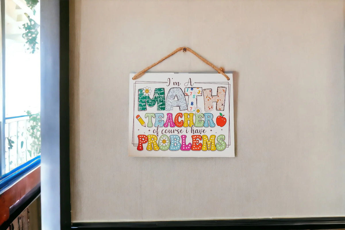 The Mirabilia Boutique Funny Math Teacher Classroom Sign features "I'm A Math Teacher Of Course I Have Problems" in playful fonts with colorful graphics—ideal as door or wall decor and a perfect Teacher Appreciation Gift.