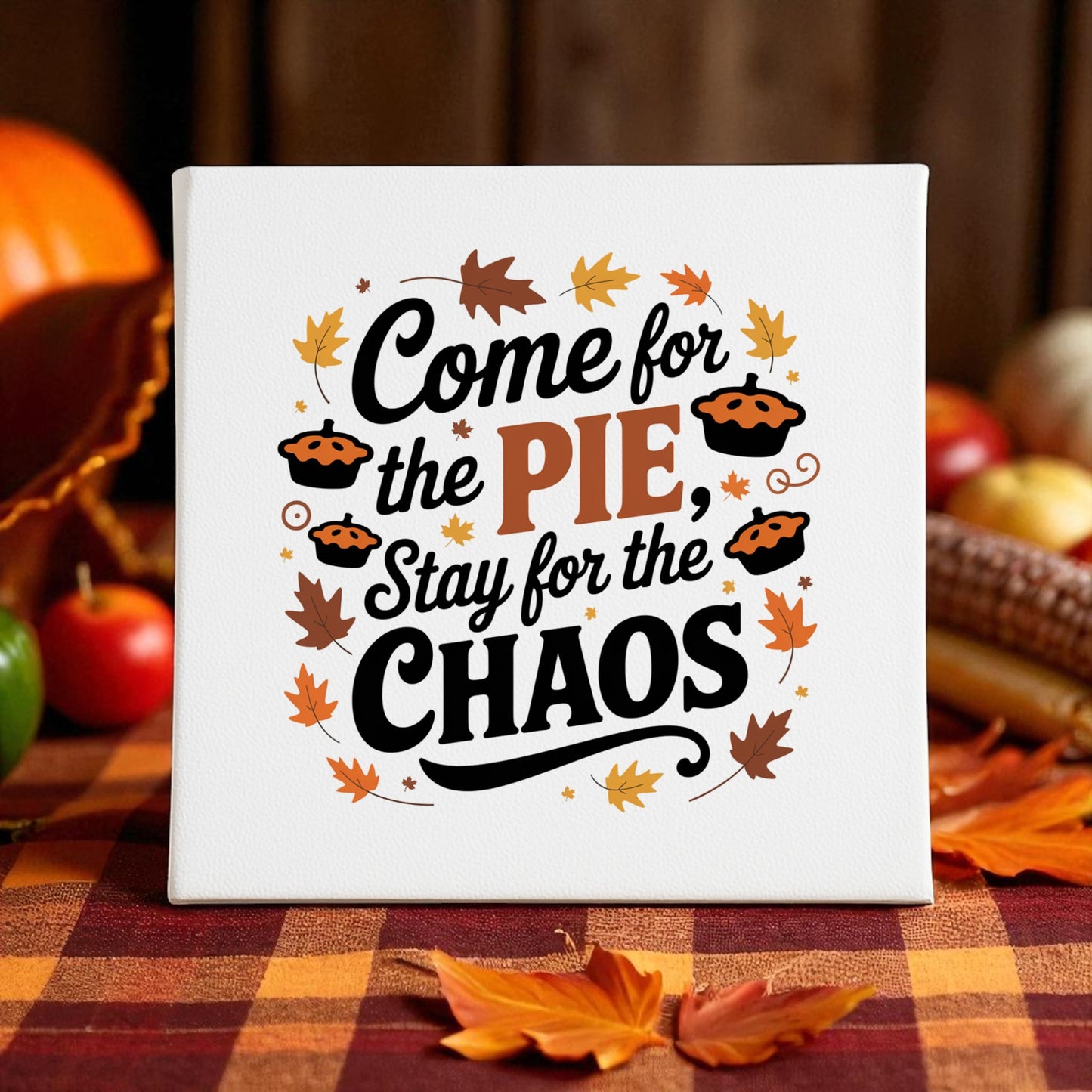 The Mirabilia Boutique's "Come for the Pie Chaos Art" funny Thanksgiving canvas adds humor to your fall table décor—featuring the phrase "Come for the pie, stay for the chaos"—perfect as unique holiday decor.