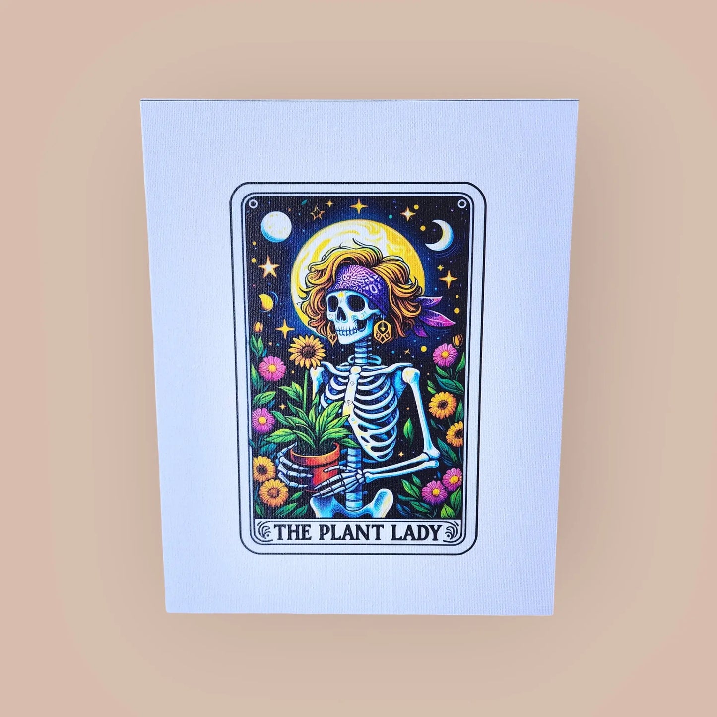 A colorful illustration of a whimsical skeleton dressed as a woman, holding a potted plant, surrounded by various plants and flowers. The background features a night sky with stars and the moon. Text at the bottom reads "The Plant Lady." This enchanting Mirabilia Boutique *The Plant Lady Gardening 8x10 Canvas Sign* is set on a light beige background.