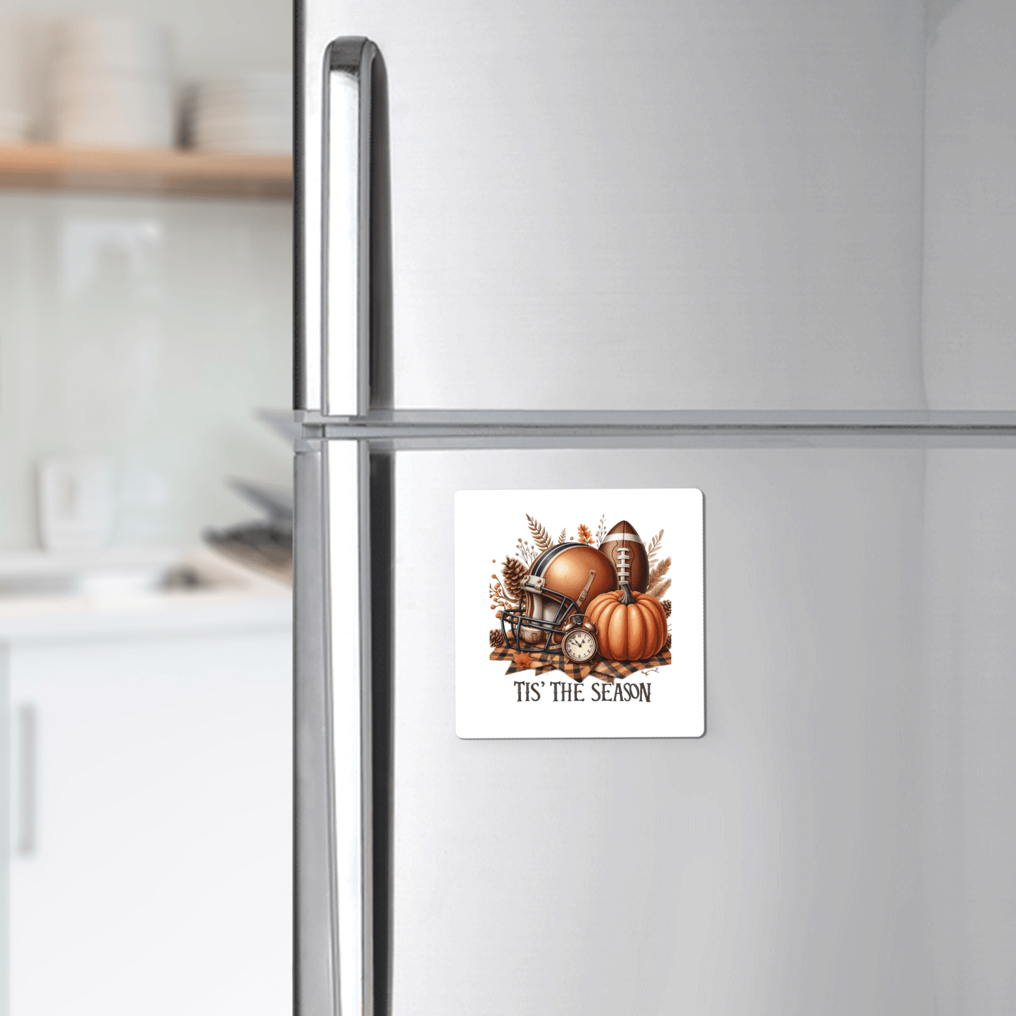 The Tis’ the Season Magnet by Mirabilia Boutique features a football, autumn leaves, helmet, and pumpkins—perfect fall football pumpkin decor for your fridge.
