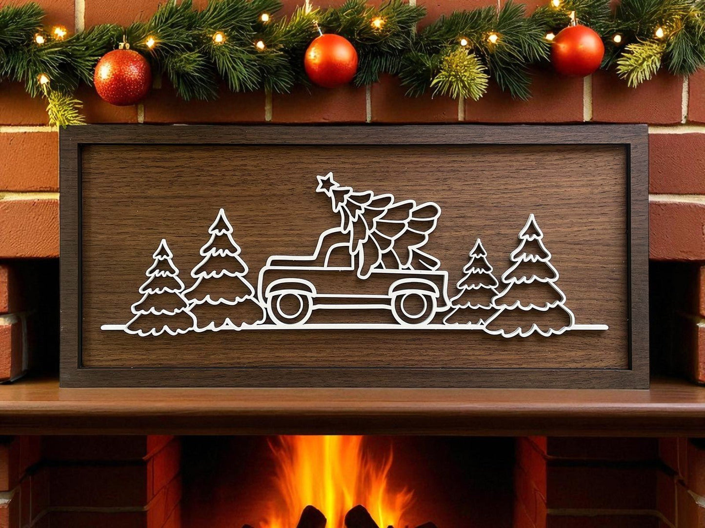 Add a rustic touch to your mantel with the Truck & Tree Laser Cut Christmas Sign (18x8) by Mirabilia Boutique, featuring a festive truck and pine tree design above a cozy holiday fireplace scene.