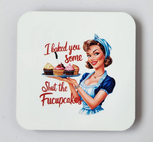 The I Baked You Some Shut The Fucupcakes magnet from Mirabilia Boutique features a vintage-style illustration of a woman in a maid outfit holding a tray of cupcakes. The text "I baked you some Shut the Fucupcakes" is written in red cursive font, perfectly blending humor with retro aesthetics. Set against a plain white background, this snarky retro magnet keeps the focus on its cheeky design, making it an ideal gift for any occasion.